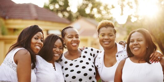 Image of diverse group of women practicing wellness activities