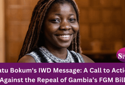 Image of Isatu Bokum delivering a speech or holding a sign advocating against the repeal of Gambia