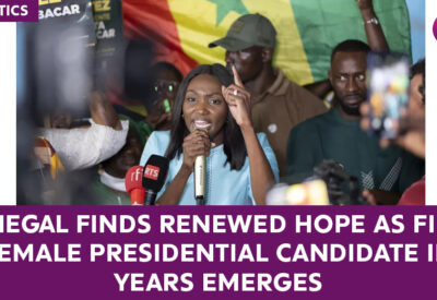 A woman speaking at a political rally, symbolizing hope and progress in Senegal